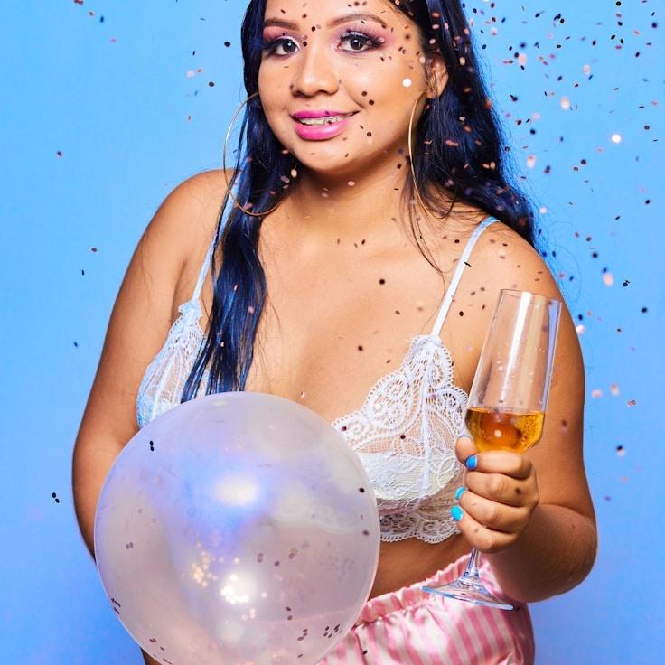 Lina Kapoor, Lead Design Curator at GardenQuietPlume, reviewing corporate floral arrangements